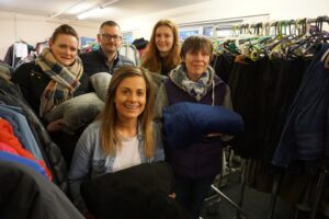 The All-in-One Company brand manager Rachel Lister (front), Winter Warmer volunteers and donated blankets.