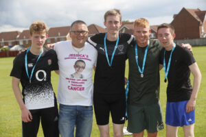 Trevor Robson with winner Josh Fiddaman (thrid from left) teacher Ben Christensen and early finishers
