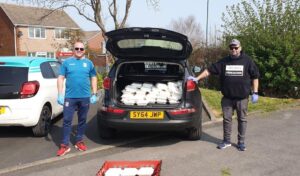 Kitchen Therapy deliveries in East Cleveland by (left) Lee Harding from MFC Foundation and Chef Matei Baran