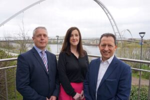 (from left) Simon Pettit and Clare Moss from WSP with Richard Wilson of Dodds Brown outside Northshore One